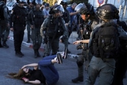 Israeli police scuffle with protesters in the Sheikh Jarrah neighborhood of east Jerusalem on May 15, 2021.