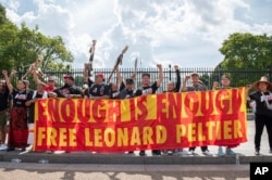 Indigenous leaders and allies gather outside the White House to urge President Joe Biden to grant clemency to imprisoned activist Leonard Peltier on Sept. 12, 2023, in Washington.