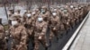 Tim medis militer yang dikerahkan ke Rumah Sakit Jinyintan di Wuhan, Provinsi Hubei, untuk membantu penanganan pasien yang terjangkit virus Corona, 26 Januari 2020. (Cheng Min/Xinhua via AP)
