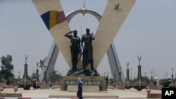 FILE - A man walks past "Place de la Nation" park in N'Djamena, Chad, April 26, 2021.