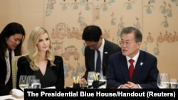South Korean President Moon Jae-In talks with Ivanka Trump during their dinner at the Presidential Blue House in Seoul, South Korea, Feb. 23, 2018. 