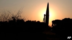 In this photo released by Russian Defense Ministry Press Service on Tuesday, May 21, 2024, a Russian Iskander missile is seen during drills to train the military for using tactical nuclear weapons at an undisclosed location in Russia. 