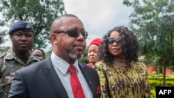 Saulos Klaus Chilima, a petitioner in the Malawi elections case, accompanied by his wife, Mary, waits to be screened at Lilongwe High Court, where judges later annulled the May 2019 election, in Lilongwe, Feb. 3, 2020.