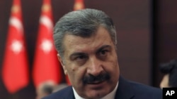 Turkey's Health Minister Fahrettin Koca speaks to journalists after a coronavirus meeting in Ankara, March 18, 2020.