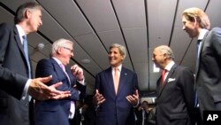 French Foreign Minister Laurent Fabius, second right, German Foreign Minister Frank-Walter Steinmeier, second left, British Foreign Secretary Philip Hammond, left, US Secretary of State John Kerry, center, and Austria's Foreign Minister Sebastian Kurz, ri