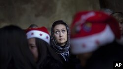 A Christian pilgrim lines up to go inside the Grotto, at the Church of Nativity, believed by many to be the birthplace of Jesus Christ, in the West Bank town of Bethlehem, Dec. 24, 2011.