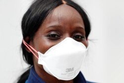 Home care nurse Flora Ajayi poses for a portrait after visiting a client during the ongoing coronavirus disease (COVID-19) outbreak, in the Queens borough of New York City, April 22, 2020.