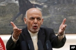 FILE - Afghan President Ashraf Ghani, speaks during a press conference at the presidential palace in Kabul, Afghanistan.