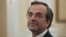 Newly appointed Greek Prime Minister Antonis Samaras smiles before a swearing in ceremony at the presidential palace in Athens, June 20, 2012. 
