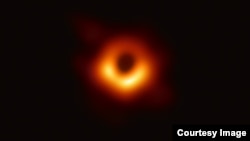 An image of the black hole at the center of Messier 87, a massive galaxy in the nearby Virgo galaxy cluster. This black hole resides 55 million light-years from Earth and has a mass 6.5-billion times that of the Sun.