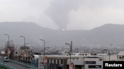 Fire is seen at a military site after it was hit by an airstrike at the Faj Attan mountain of Sanaa, April 6, 2015. 