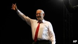FILE - Abdel-Monaem Abul Fetouh, then an Egyptian presidential candidate, waves to his supporters during a campaign rally in Cairo, May 18, 2012.
