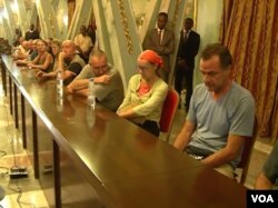 Freed hostages meet with Cameroon's Minister of Communications in Yaounde, April 4, 2018. (Photo: Moki Kindzeka for VOA)