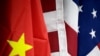 FILE - The flags of the US and China are displayed at American International Chamber of Commerce (AICC)'s booth during China International Fair for Trade in Services in Beijing, China, May 28, 2019.