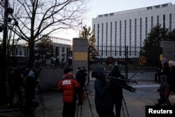 Television crews assemble outside the Russian Embassy on Wisconsin Avenue in Washington, U.S., Dec. 29, 2016.