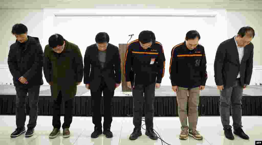 Jeju Air CEO Kim E-bae (3rd-R) and other executive members bow in apology ahead of a briefing in Seoul, Dec. 29, 2024,