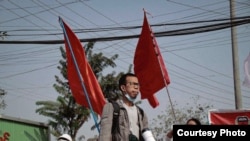 People protest in Mandalay, June 14, 2021.