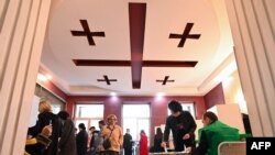 People visit a polling station to vote in Georgia's parliamentary election in Tbilisi on Oct. 31, 2020.