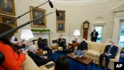 President Joe Biden, accompanied by Vice President Kamala Harris and Treasury Secretary Janet Yellen, meets with business leaders to discuss a coronavirus relief package in the White House, Feb. 9, 2021.