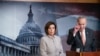 FILE - Democratic House Speaker Nancy Pelosi looks on as Senate Democratic Minority Leader Chuck Schumer speaks during a news conference, on Capitol Hill, in Washington, Feb.11, 2020.