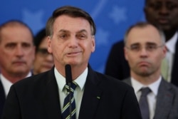 Brazil's President Jair Bolsonaro speaks during a news conference at the Planalto Presidential Palace in Brasilia, Brazil, April 24, 2020.