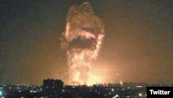 A social media image purportedly shows flames and smoke from an explosion rising into the night sky in Tianjin, China.