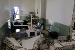 FILE - Damage is seen at a hospital after an airstrike in Deir al-Sharqi village in Idlib province, Syria, April 27 2017.