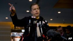 U.S. Special Representative for North Korea Policy Ambassador Glyn Davies gestures as he speaks to reporters at a hotel in Beijing, China Nov. 21, 2013.