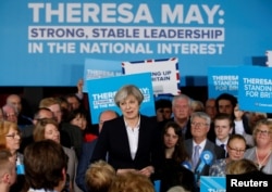 Britain's Prime Minister Theresa May delivers a speech to Conservative Party members in Mawdesley village hall, Ormskirk, Britain May 1, 2017.