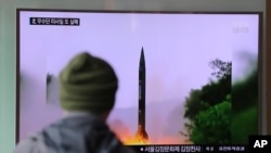 A man watches a TV news program showing a file image of missile launch conducted by North Korea, at the Seoul Railway Station in Seoul, South Korea, Oct. 20, 2016.