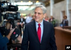 Judge Merrick Garland, President Barack Obama's choice to replace the late Justice Antonin Scalia on the Supreme Court arrives for a meeting with Sen. Angus King, I-Maine, on Capitol Hill in Washington, April 13, 2016. (AP Photo/Pablo Martinez Monsivais)