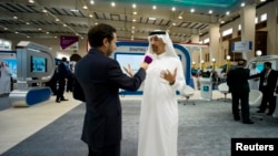 FILE - Saudi Aramco's then-CEO, Khalid al-Falih, speaks to reporter at Petrotech 2014, Bahrain International Exhibition Center, Manama, May 19, 2014.