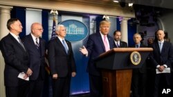 President Donald Trump, center, with members of the president's coronavirus task force speaks during a news conference at the Brady press briefing room of the White House, Feb. 26, 2020, in Washington. 