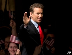 FILE - Sen. Rand Paul, R-Ky. arrives to announce the start of his presidential campaign, April 7, 2015, at the Galt House Hotel in Louisville, Kentucky.