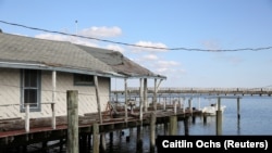 A house damaged by weather and flooding is seen in the Broad Channel neighborhood of Queens in New York City, U.S., November 2, 2019. REUTERS/Caitlin Ochs