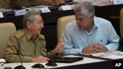 Cuba's President Raul Castro, left, talks with Vice President Miguel Diaz Canel during the opening of the National Assembly session in Havana, Cuba, Friday, July 8, 2016. 