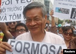 FILE - Protesters march against Formosa Plastics in Hanoi, Vietnam, May 1, 2016.