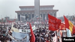 FILE: Hundreds of thousands of people, seeking political and economic reforms, crowded Beijing’s central Tiananmen Square May 17, 1989, in the biggest popular upheaval in China since the Cultural Revolution of the 1960s.
