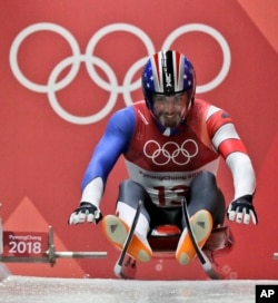 Chris Mazdzer of United States starts his first men's luge run at the 2018 Winter Olympics in Pyeongchang, South Korea, Saturday, Feb. 10, 2018. (AP Photo/Wong Maye-E)