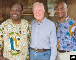 Feb. 15, 2007. Nasarawa, Nigeria. Former U.S. President and Founder of The Carter Center Jimmy Carter, stands with Carter Center Vice President of Health Programs, Dr. Donald Hopkins (right) and Guinea worm partner, former Nigerian Head of State General Y