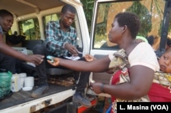 Flood survivors receive medication during mobile clinic hours in Machinga district.