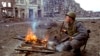 FILE - A Russian soldier lights a cigarette in the Chechen capital of Grozny, March 19, 1995. 