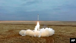 FILE - This photo taken from video provided by the Russian Defense Ministry Press Service on Feb. 19, 2022, shows a Russian Iskander-K missile launched during a military exercise at a training ground in Russia. 