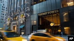 FILE - Traffic passes Trump Tower in New York, Nov. 21, 2016. 