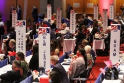 Delegates listen as Vice President Mike Pence speaks during the first day of the Republican National Convention, Aug. 24, 2020, in Charlotte, N.C.
