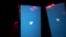A mobile phone user turns on Twitter application on his smartphone in Moscow, Russia, March 10, 2021.