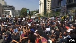 Women occupy a busy street intersection in Sandton, Johannesburg, during a protest against gender-based violence. (T. Khumalo/VOA)