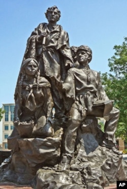 The Indian guide Sacagawea is depicted along with explorers Meriwether Lewis and William Clark on Eugene Daub’s sculpture in Kansas City.