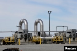 FILE - A TransCanada pipeline pump station operates outside Steele City, Nebraska, March 10, 2014.