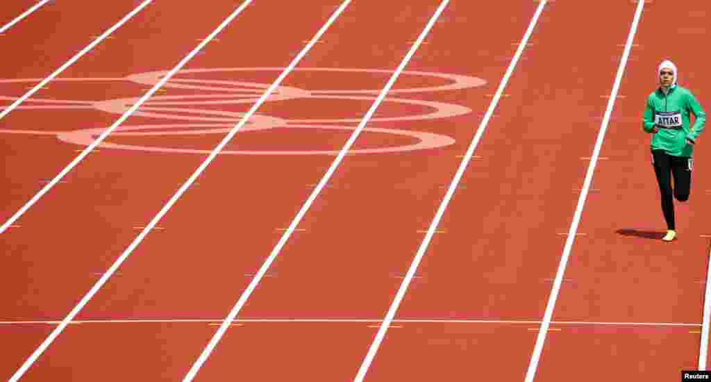 Sarah Attar, the first woman from Saudi Arabia to compete in Olympic track and field, runs in her women's 800m round 1 heat.